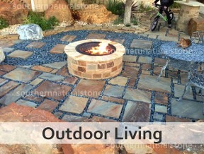 Outdoor living space with stone patio and fire pit