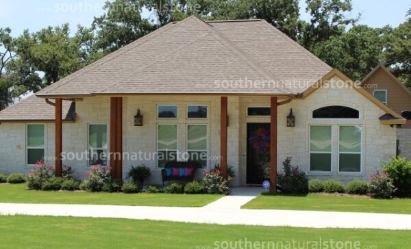 Blanco walls on front yard with lush greeneries