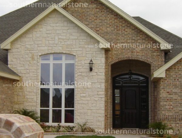 Black front door with a Roan wall sample